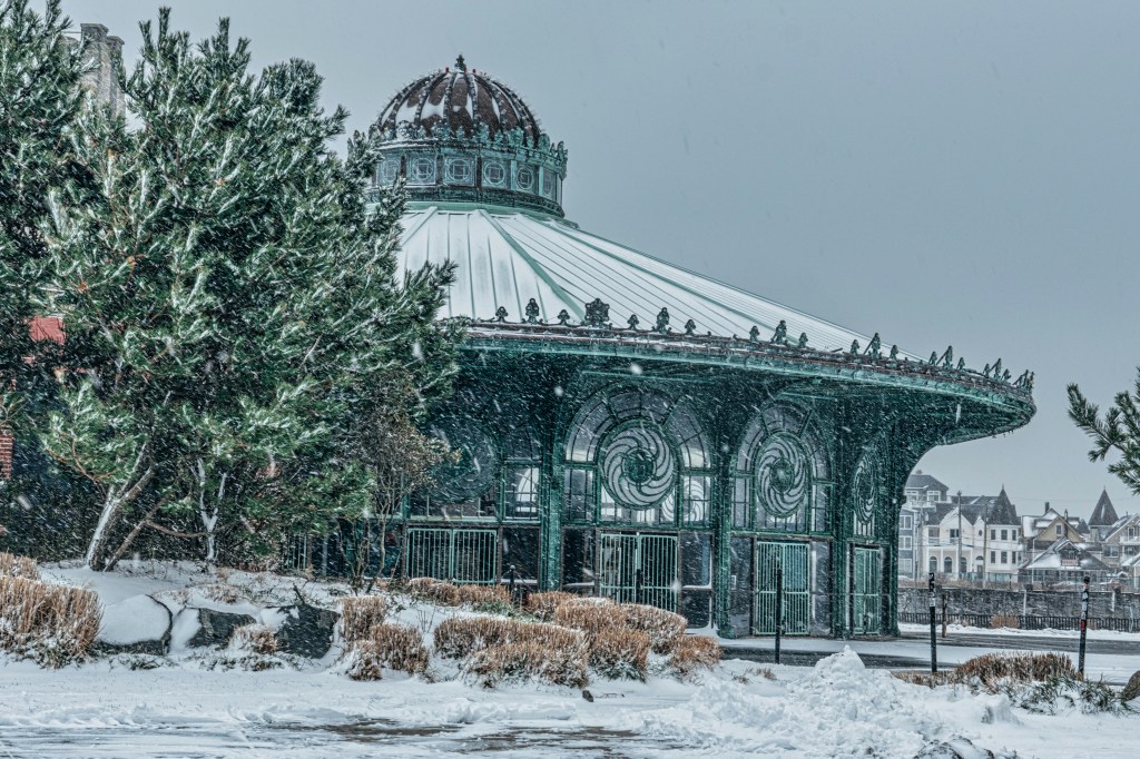 Asbury Park Convention Hall covered in snow along the beach during winter storm