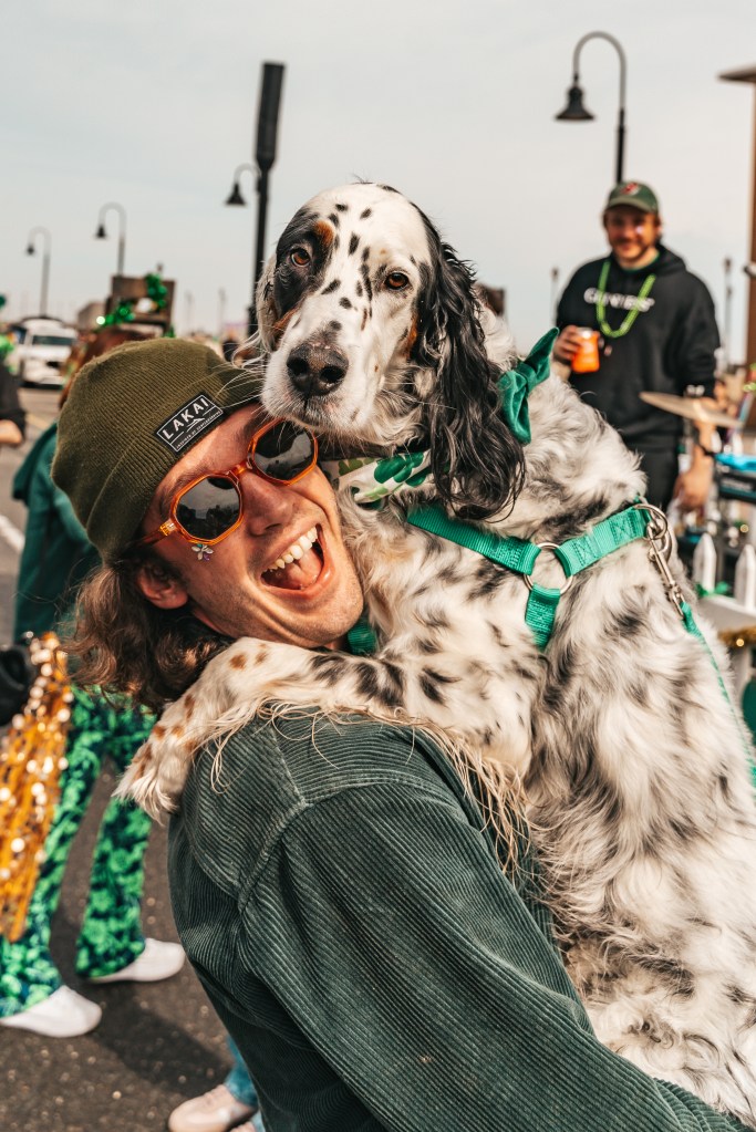 Asbury Park St Patrick's Day Parade bagpipers marching
Crowd celebrating St Patrick's Day parade Asbury Park NJ
Children waving flags at Asbury Park parade