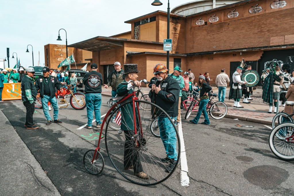 Asbury Park St Patrick's Day Parade bagpipers marching
Crowd celebrating St Patrick's Day parade Asbury Park NJ
Children waving flags at Asbury Park parade