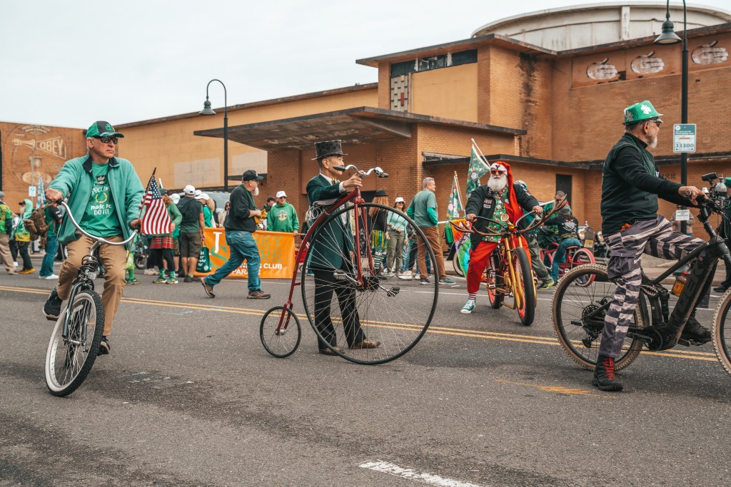 Asbury Park St Patrick's Day Parade bagpipers marching
Crowd celebrating St Patrick's Day parade Asbury Park NJ
Children waving flags at Asbury Park parade