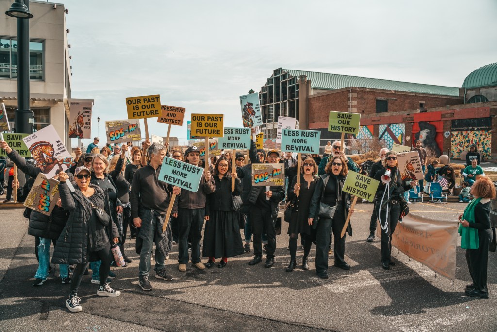 Asbury Park St Patrick's Day Parade bagpipers marching
Crowd celebrating St Patrick's Day parade Asbury Park NJ
Children waving flags at Asbury Park parade